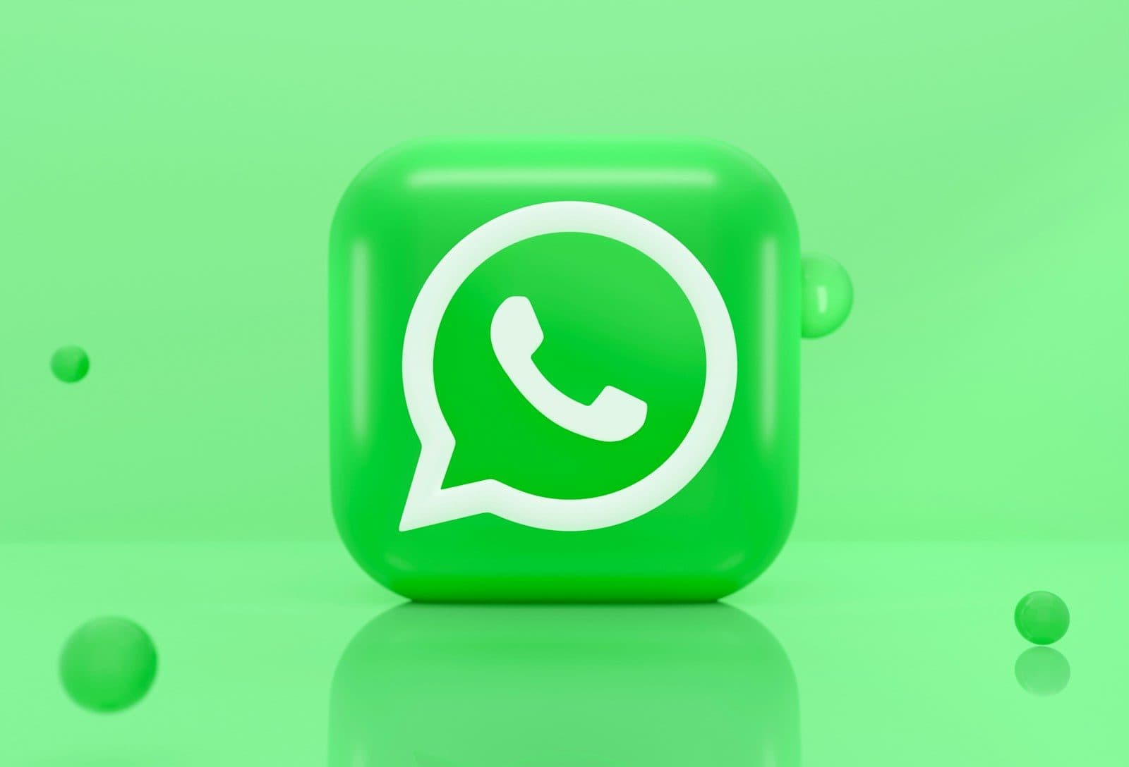 A green 3D icon of a telephone handset inside a speech bubble