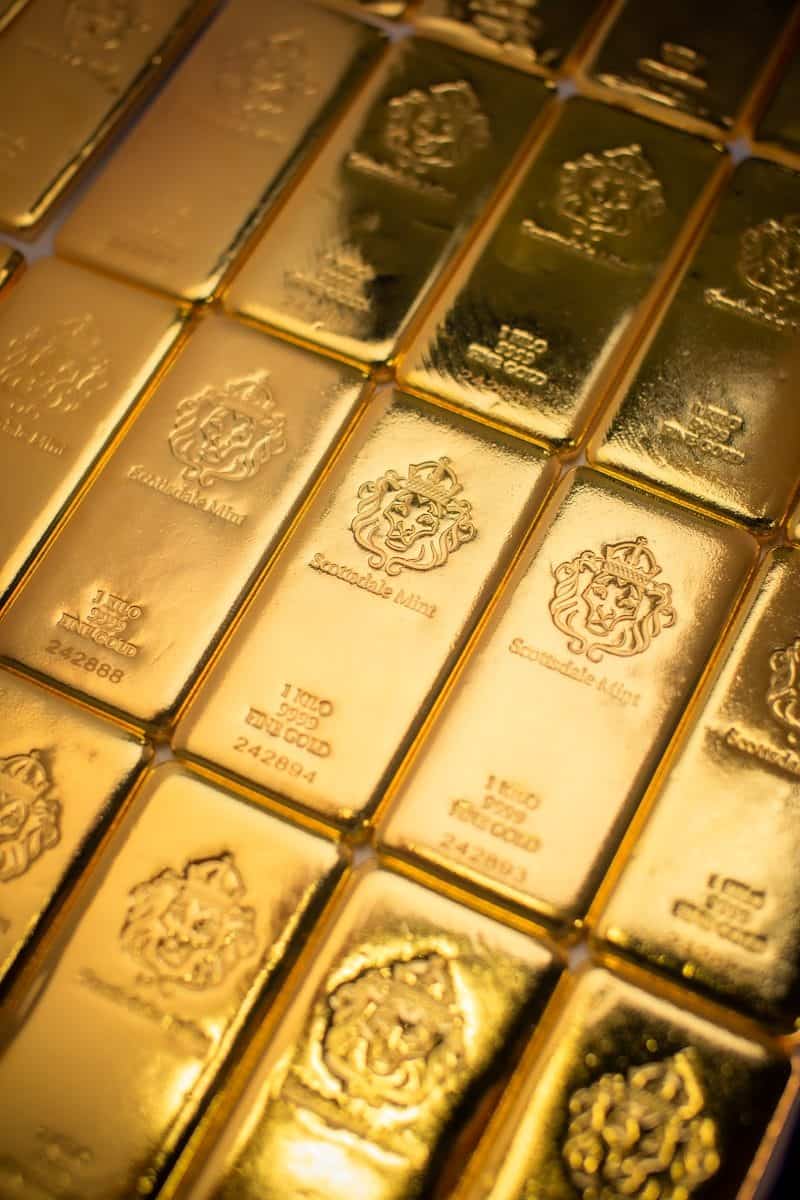 A pile of gold bars sitting on top of a table