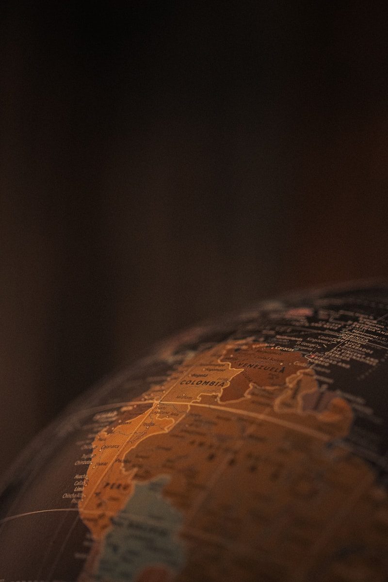 A close up of a globe with a blurry background