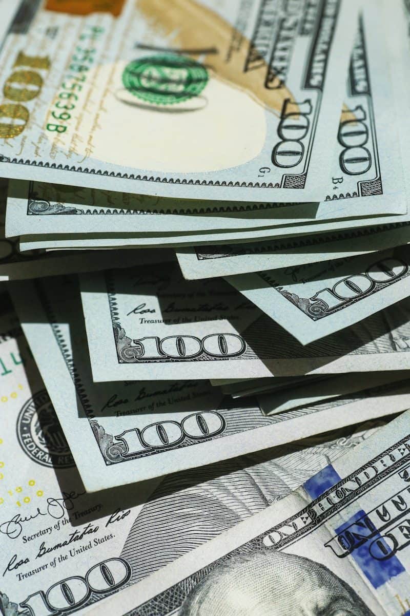 close up of stacked hundred dollar bills