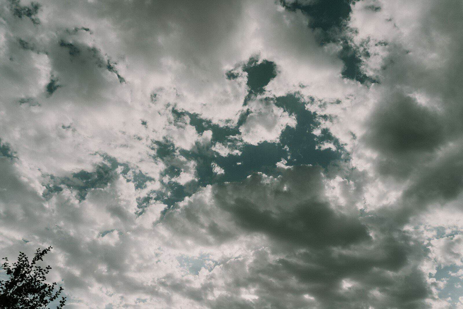 Dramatic clouds fill a grey sky.