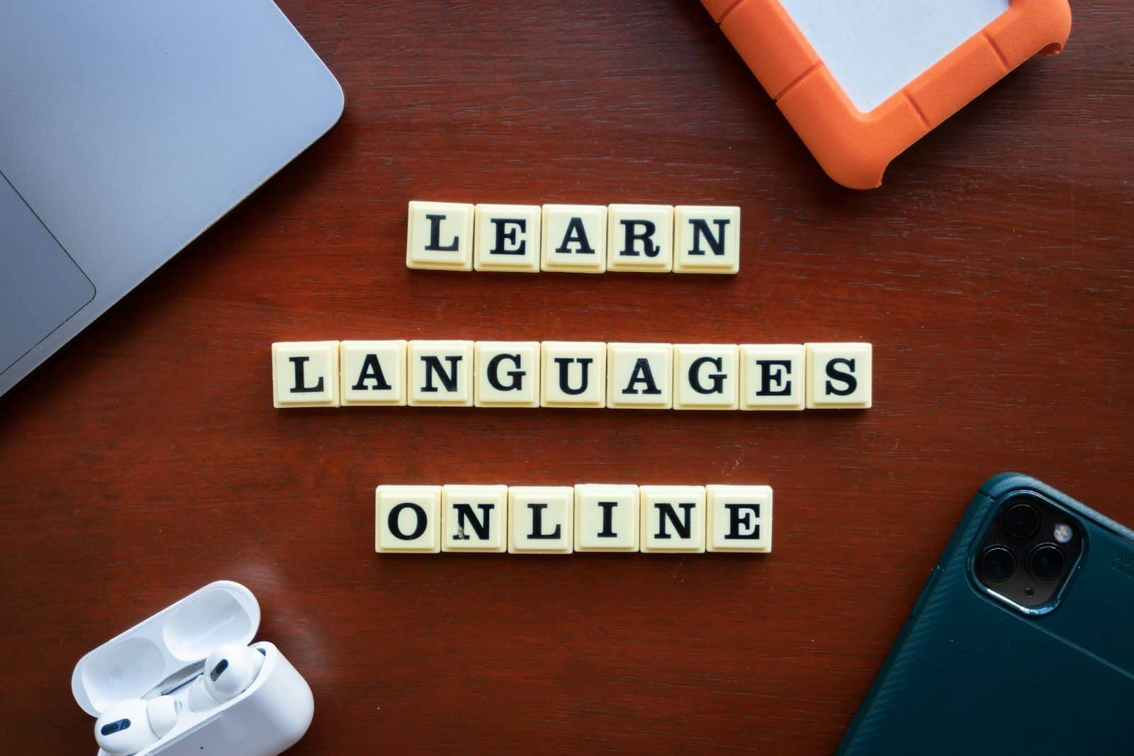 scrabble tiles spelling learn languages on a table