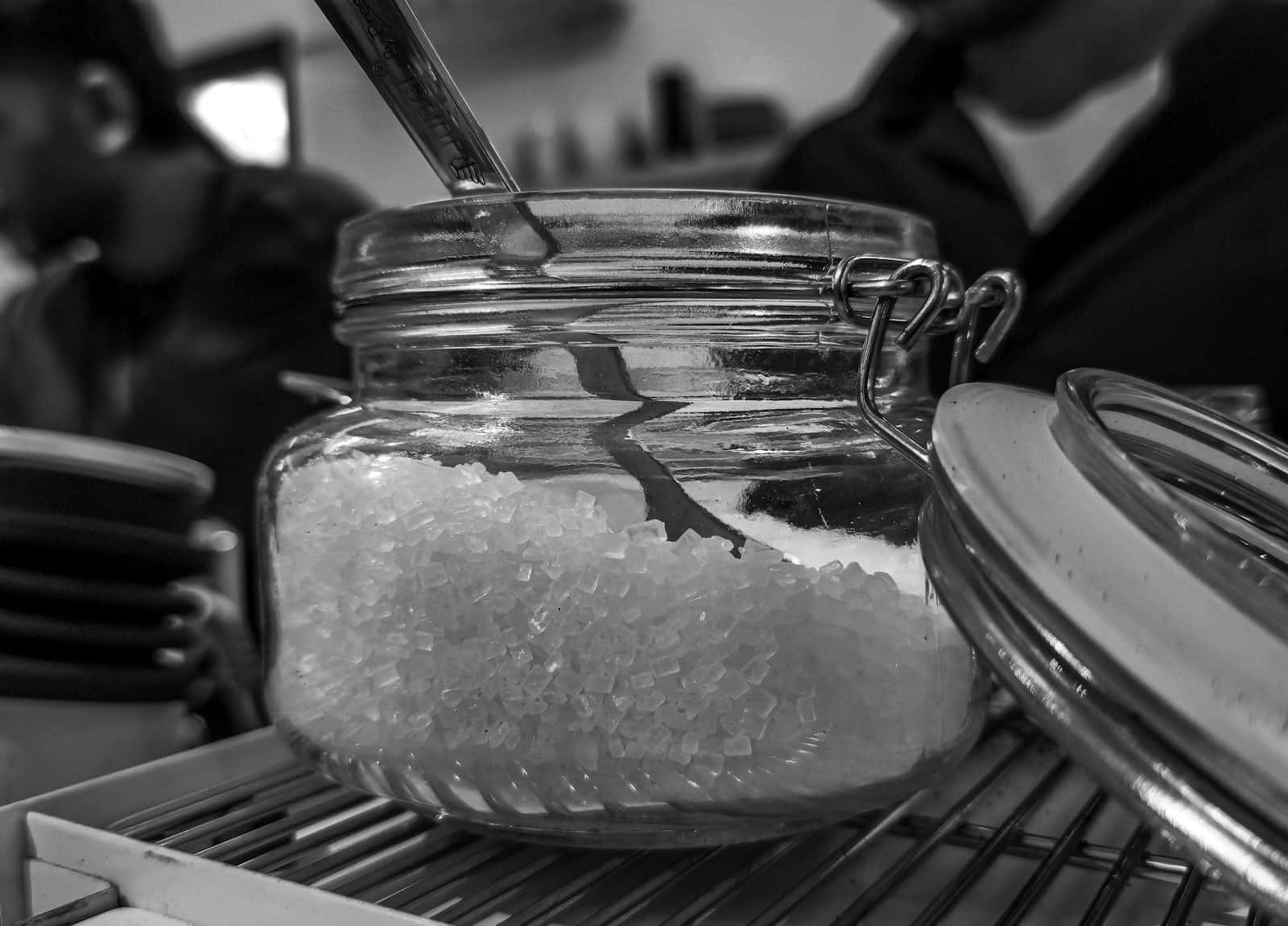 A jar filled with coarse salt and a spoon