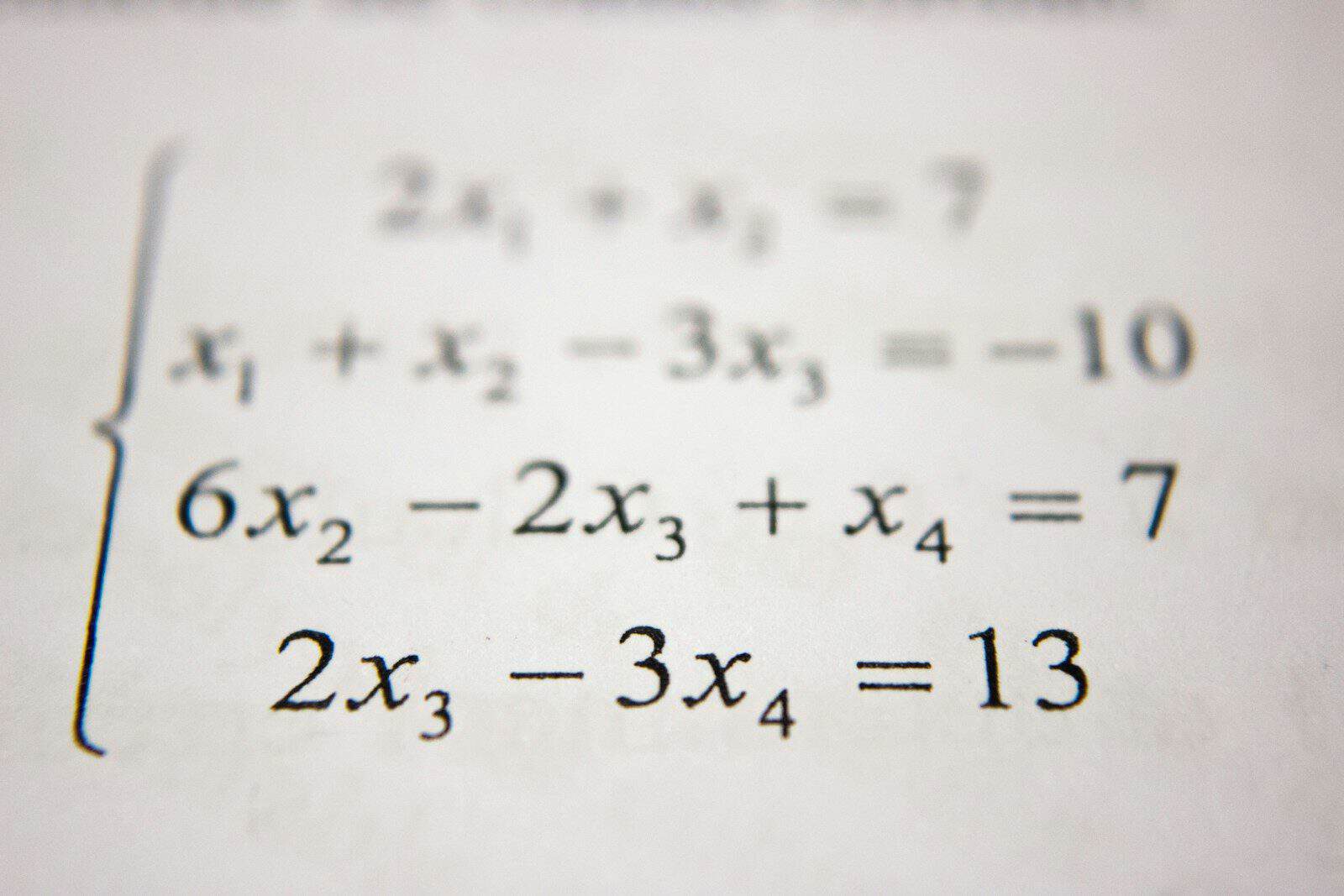 A system of linear equations printed in black ink on white paper