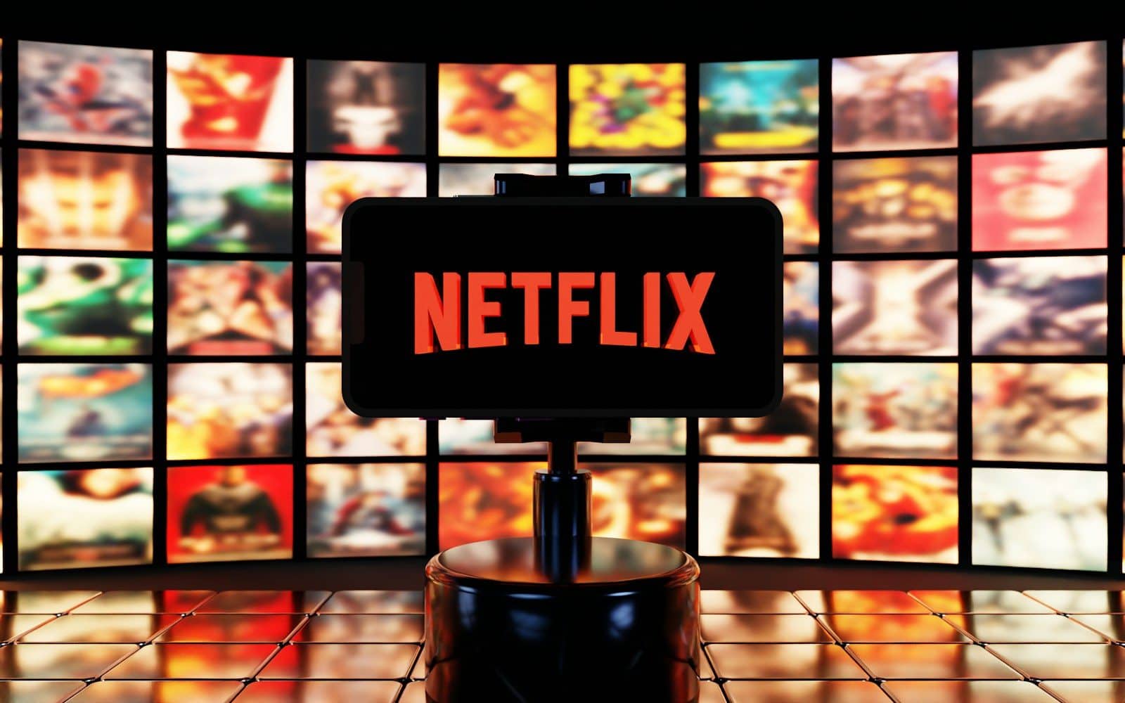 Netflix logo displayed on a screen with many movie posters